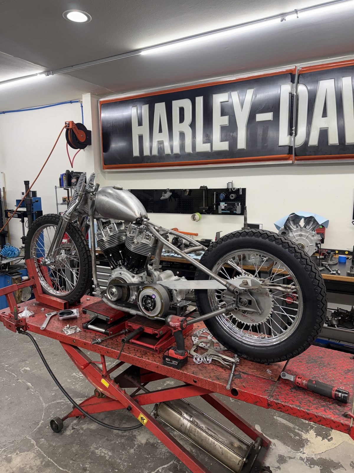 1977 Shovelhead chopper build on the lift with fresh wheels and tires mounted